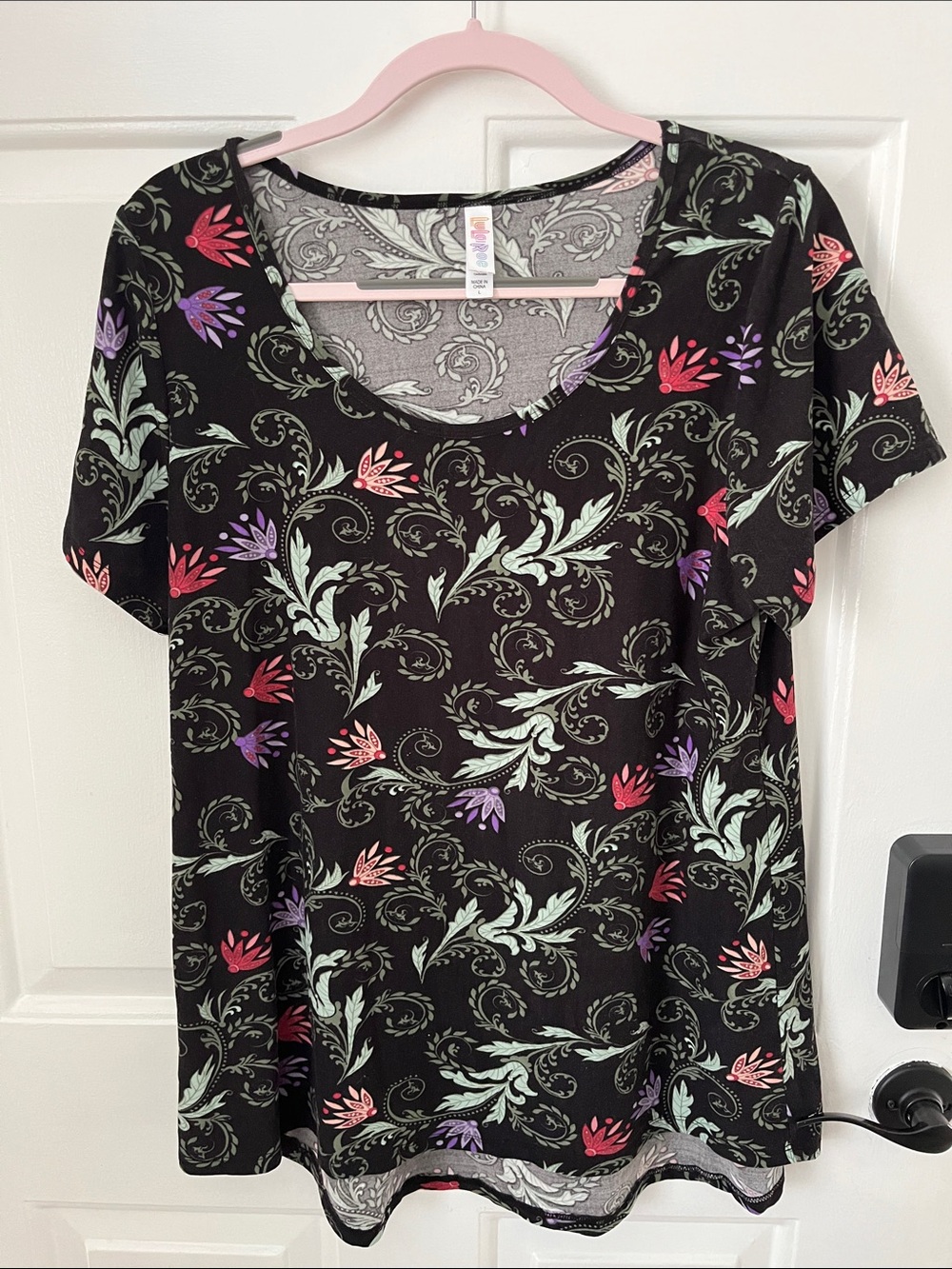 LuLaRoe Black Short Sleeve Tee with Pink, Purple & Mint Floral Motif